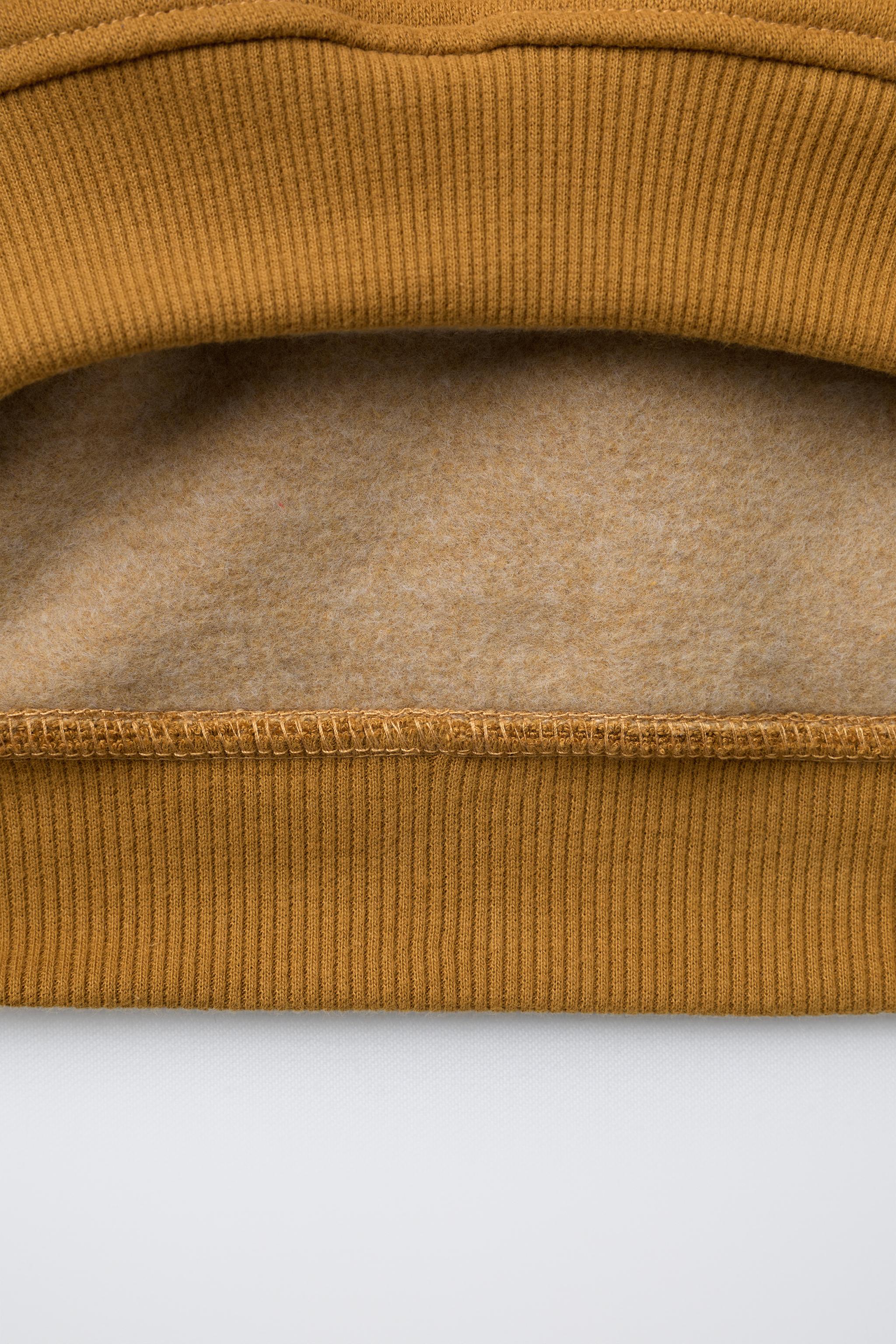 RAISED TEXT HOODIE SWEATSHIRT